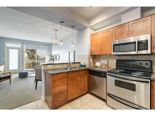 9-148 Rockyledge View Nw, Calgary, AB - Indoor Photo Showing Kitchen With Double Sink