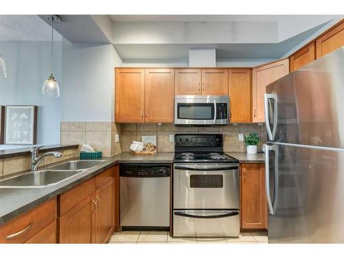 9-148 Rockyledge View Nw, Calgary, AB - Indoor Photo Showing Kitchen With Double Sink