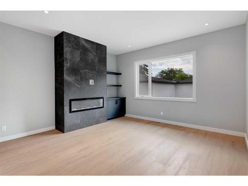 910 32 Street Nw, Calgary, AB - Indoor Photo Showing Other Room With Fireplace