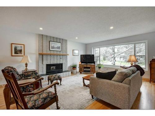 931 Maplecroft Road Se, Calgary, AB - Indoor Photo Showing Living Room With Fireplace