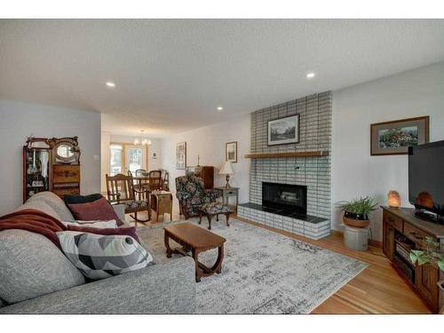 931 Maplecroft Road Se, Calgary, AB - Indoor Photo Showing Living Room With Fireplace