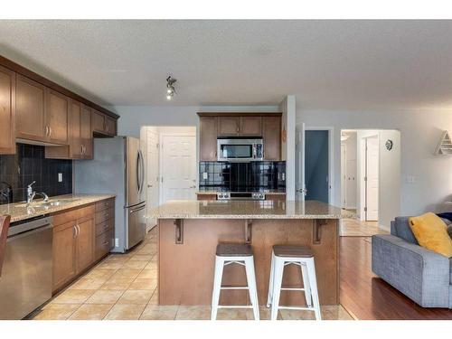 1019 Windhaven Close Sw, Airdrie, AB - Indoor Photo Showing Kitchen With Double Sink