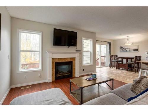 1019 Windhaven Close Sw, Airdrie, AB - Indoor Photo Showing Living Room With Fireplace