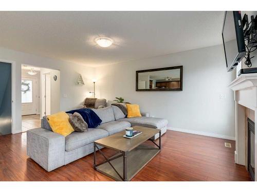 1019 Windhaven Close Sw, Airdrie, AB - Indoor Photo Showing Living Room With Fireplace