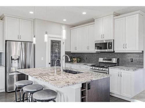 245 Riverwood Crescent Sw, Diamond Valley, AB - Indoor Photo Showing Kitchen With Double Sink With Upgraded Kitchen