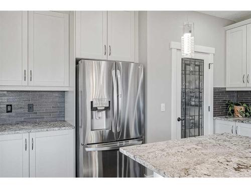 245 Riverwood Crescent Sw, Diamond Valley, AB - Indoor Photo Showing Kitchen With Upgraded Kitchen