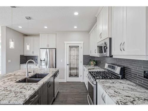 245 Riverwood Crescent Sw, Diamond Valley, AB - Indoor Photo Showing Kitchen With Double Sink With Upgraded Kitchen