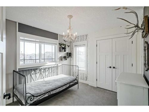 245 Riverwood Crescent Sw, Diamond Valley, AB - Indoor Photo Showing Bedroom