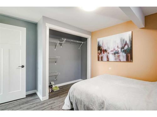 245 Riverwood Crescent Sw, Diamond Valley, AB - Indoor Photo Showing Bedroom