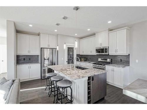 245 Riverwood Crescent Sw, Diamond Valley, AB - Indoor Photo Showing Kitchen With Double Sink With Upgraded Kitchen