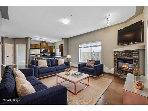 504-20 Discovery Ridge Close Sw, Calgary, AB - Indoor Photo Showing Living Room With Fireplace