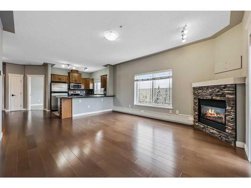 504-20 Discovery Ridge Close Sw, Calgary, AB - Indoor Photo Showing Living Room With Fireplace