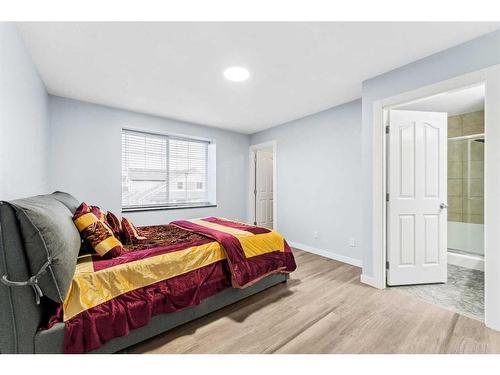 250 Luxstone Road Sw, Airdrie, AB - Indoor Photo Showing Bedroom