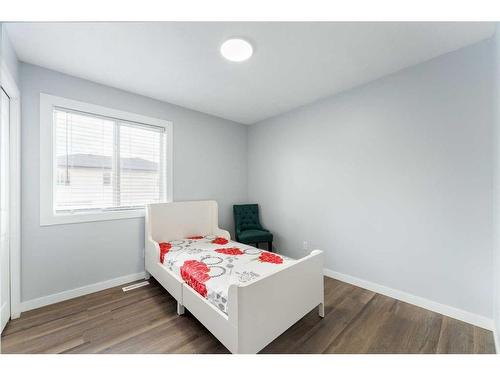 250 Luxstone Road Sw, Airdrie, AB - Indoor Photo Showing Bedroom