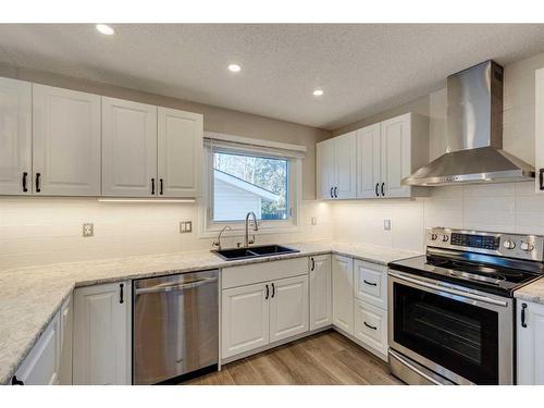 80 Woodglen Close Sw, Calgary, AB - Indoor Photo Showing Kitchen With Stainless Steel Kitchen With Double Sink With Upgraded Kitchen