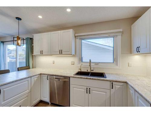 80 Woodglen Close Sw, Calgary, AB - Indoor Photo Showing Kitchen With Double Sink With Upgraded Kitchen