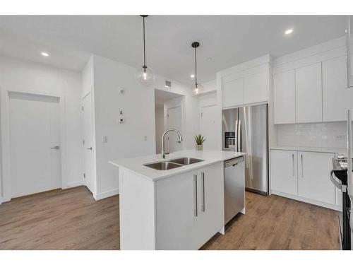 3105-111 Wolf Creek Drive Se, Calgary, AB - Indoor Photo Showing Kitchen With Double Sink With Upgraded Kitchen