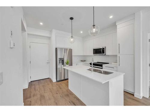 3105-111 Wolf Creek Drive Se, Calgary, AB - Indoor Photo Showing Kitchen With Double Sink With Upgraded Kitchen