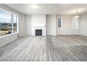 181 Carrington Crescent Nw, Calgary, AB  - Indoor Photo Showing Living Room With Fireplace 