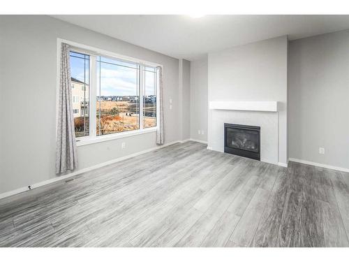 181 Carrington Crescent Nw, Calgary, AB - Indoor Photo Showing Living Room With Fireplace