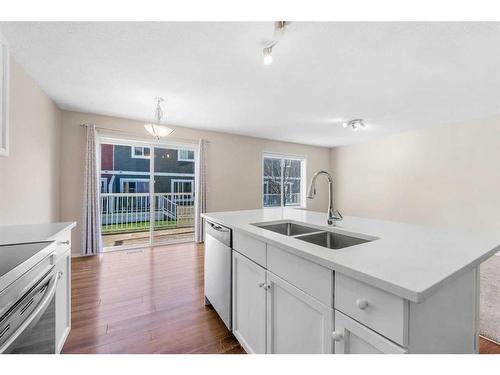 503-800 Yankee Valley Boulevard Se, Airdrie, AB - Indoor Photo Showing Kitchen With Double Sink