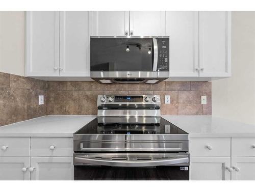 503-800 Yankee Valley Boulevard Se, Airdrie, AB - Indoor Photo Showing Kitchen With Upgraded Kitchen