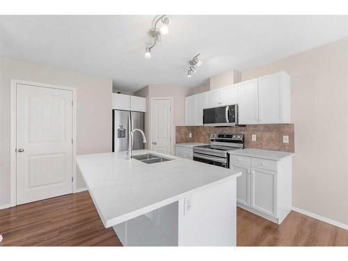 503-800 Yankee Valley Boulevard Se, Airdrie, AB - Indoor Photo Showing Kitchen With Double Sink With Upgraded Kitchen