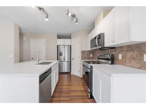 503-800 Yankee Valley Boulevard Se, Airdrie, AB - Indoor Photo Showing Kitchen With Double Sink With Upgraded Kitchen