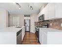 503-800 Yankee Valley Boulevard Se, Airdrie, AB  - Indoor Photo Showing Kitchen With Double Sink With Upgraded Kitchen 