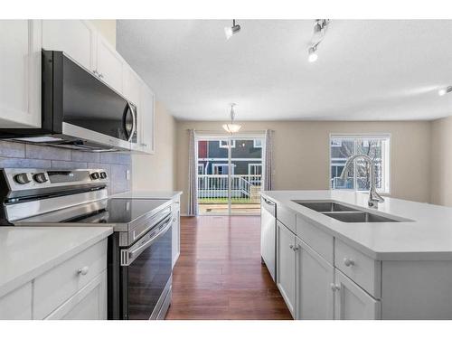 503-800 Yankee Valley Boulevard Se, Airdrie, AB - Indoor Photo Showing Kitchen With Double Sink