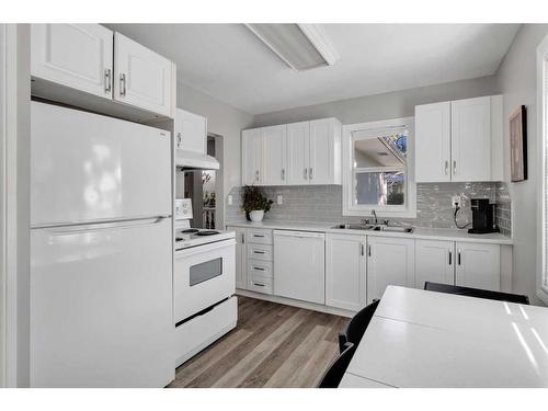 669 Northmount Drive Nw, Calgary, AB - Indoor Photo Showing Kitchen With Double Sink