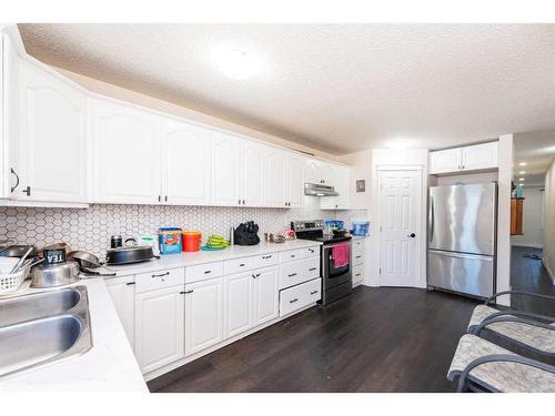 55 Falchurch Road Ne, Calgary, AB - Indoor Photo Showing Kitchen With Double Sink