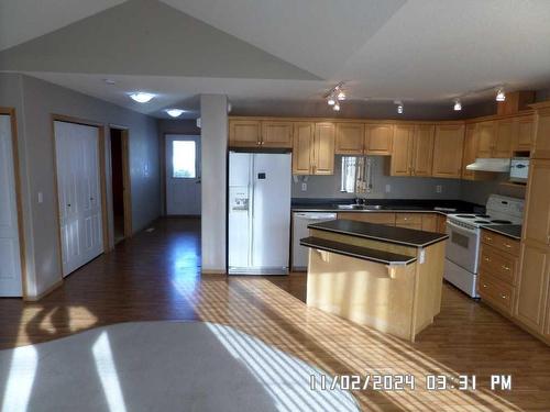 405 Hope Bay, Rural Rocky View County, AB - Indoor Photo Showing Kitchen With Double Sink