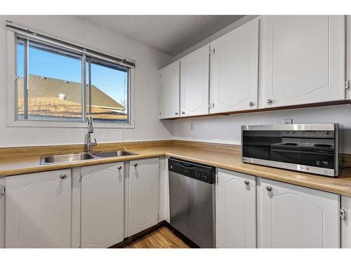 4624 81 Street Nw, Calgary, AB - Indoor Photo Showing Kitchen With Double Sink