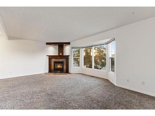 4624 81 Street Nw, Calgary, AB - Indoor Photo Showing Living Room With Fireplace