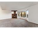 4624 81 Street Nw, Calgary, AB  - Indoor Photo Showing Living Room With Fireplace 