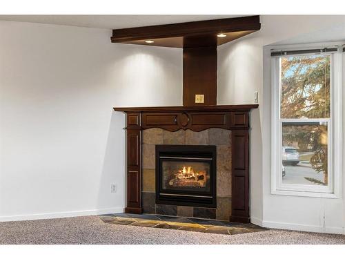 4624 81 Street Nw, Calgary, AB - Indoor Photo Showing Living Room With Fireplace