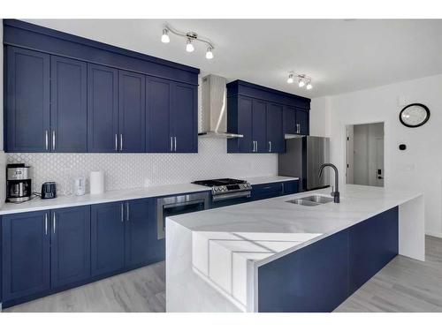 901 Windsong Drive Sw, Airdrie, AB - Indoor Photo Showing Kitchen With Double Sink With Upgraded Kitchen