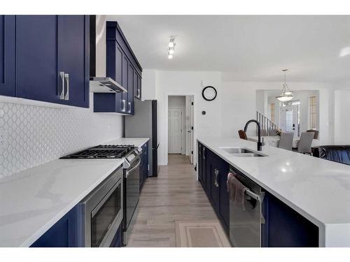 901 Windsong Drive Sw, Airdrie, AB - Indoor Photo Showing Kitchen With Double Sink