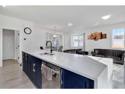 901 Windsong Drive Sw, Airdrie, AB - Indoor Photo Showing Kitchen With Double Sink