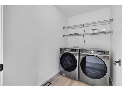 901 Windsong Drive Sw, Airdrie, AB - Indoor Photo Showing Laundry Room