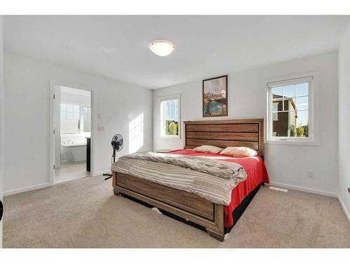 901 Windsong Drive Sw, Airdrie, AB - Indoor Photo Showing Bedroom