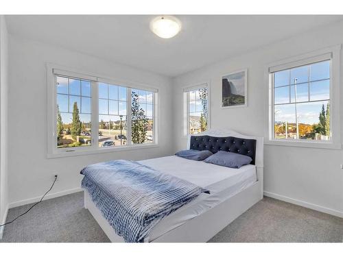 901 Windsong Drive Sw, Airdrie, AB - Indoor Photo Showing Bedroom