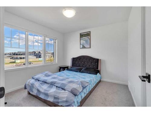 901 Windsong Drive Sw, Airdrie, AB - Indoor Photo Showing Bedroom