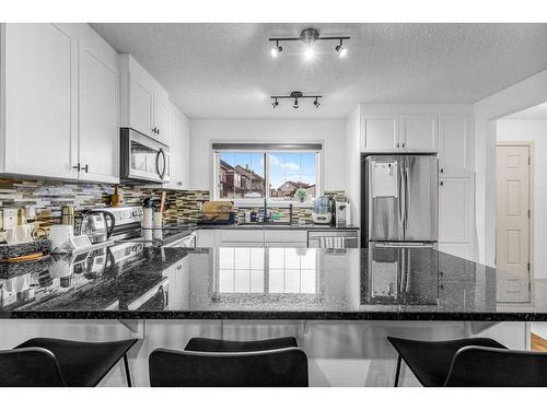 385 Legacy Boulevard Boulevard Se, Calgary, AB - Indoor Photo Showing Kitchen With Stainless Steel Kitchen With Double Sink With Upgraded Kitchen