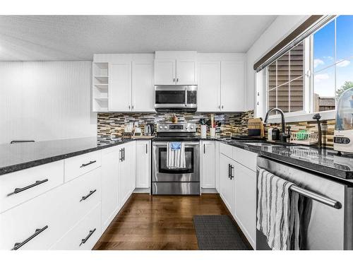 385 Legacy Boulevard Boulevard Se, Calgary, AB - Indoor Photo Showing Kitchen With Stainless Steel Kitchen With Double Sink With Upgraded Kitchen