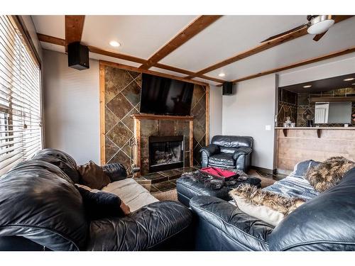 1518 High Park Drive Nw, High River, AB - Indoor Photo Showing Living Room With Fireplace