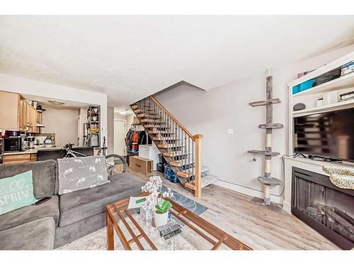 4-810 2 Street Ne, Calgary, AB - Indoor Photo Showing Living Room With Fireplace