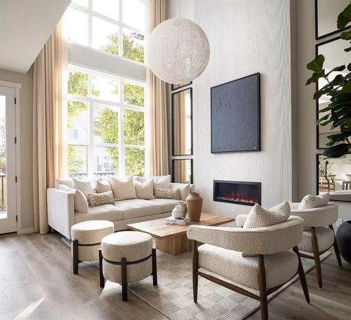 246 Hotchkiss Manor Se, Calgary, AB - Indoor Photo Showing Living Room With Fireplace