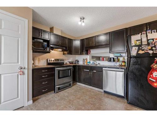 13 Copperfield Court Se, Calgary, AB - Indoor Photo Showing Kitchen